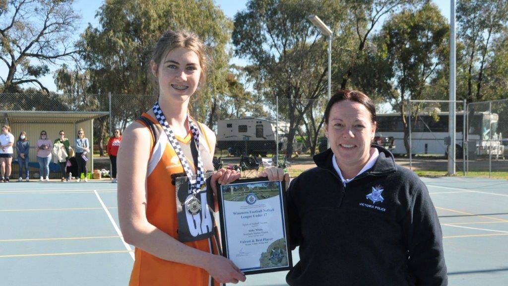 CONSISTENT: Abby White photographed receiving her award from Warracknabeal Police Officer Senior Constable Anna Lake at Beulah.