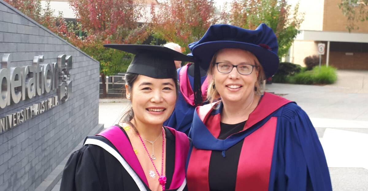 PROUD: Federation University graduate Thablay Khinshwe (left) and PhD graduate Cathy Tischler. Picture: CONTRIBUTED 
