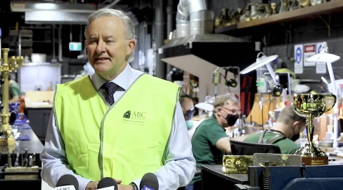 SECRET'S OUT: Opposition Leader Anthony Albanese addresses the media at the W.J. Sanders workshop in his electorate of Grayndler, the Melbourne Cup to his right.