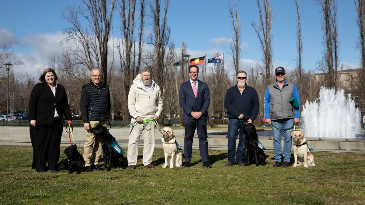 Minister Matt Keogh pictured with veterans and their service dogs. Picture: Supplied