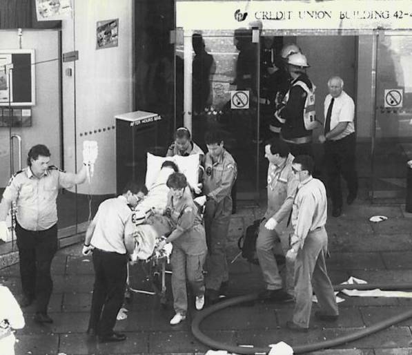 A victim is wheeled out by paramedics after the attack on March 2, 1994.