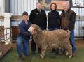 PROUD SALE: Co-stud principals Jack, Lynne and Jack Beaton, Kevlyn, Coojar with Nutrien stud stock Merino specialist Stephen Chalmers and their ram KLN 210011 which sold for $20,000 in a private on-farm sale.
