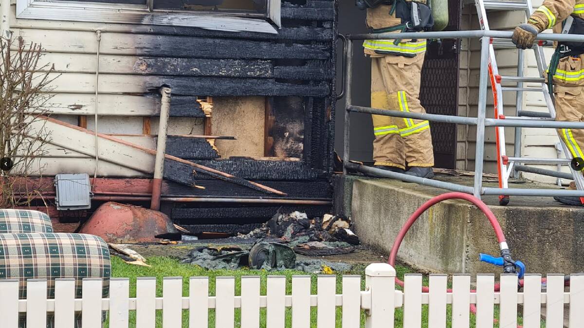 BIN: This yellow-lidded wheelie bin was left almost unrecognisable after it ignited a house fire in Primrose Street. Picture: Gabrielle Hodson.