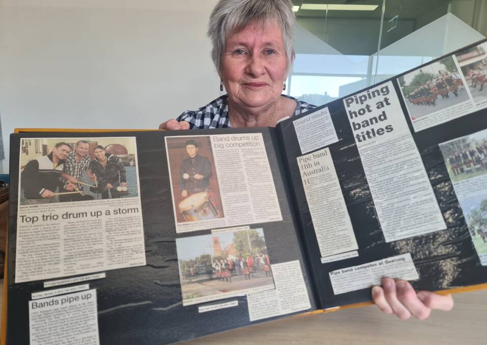 Horsham City Pipe Band will perform at the Rupunyap Anzac Day Service. Liz Minne with a scrap book record of the band's achievements. Picture by Sheryl Lowe