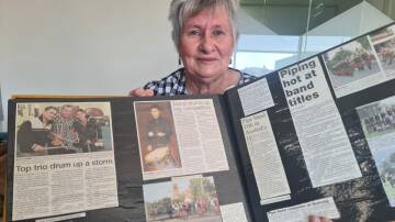 Horsham City Pipe Band will perform at the Rupunyap Anzac Day Service. Liz Minne with a scrap book record of the band's achievements. Picture by Sheryl Lowe