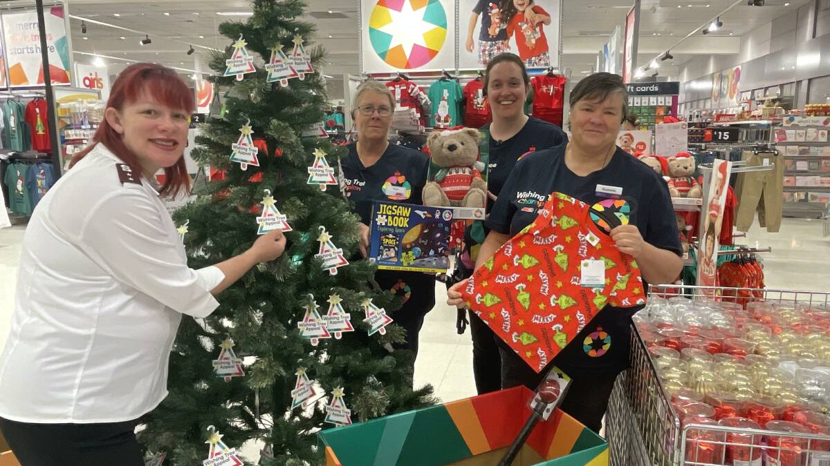 Capt Tracey Sutton, with Kmart Wishing Tree Champions Kylie, Jaime and Suzanne. Picture by Sheryl Lowe