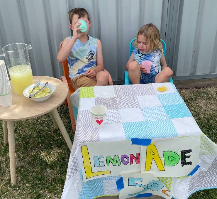 Young Jensen and Linc Pickering found out the lemonade business was thirsty work. Picture supplied.
