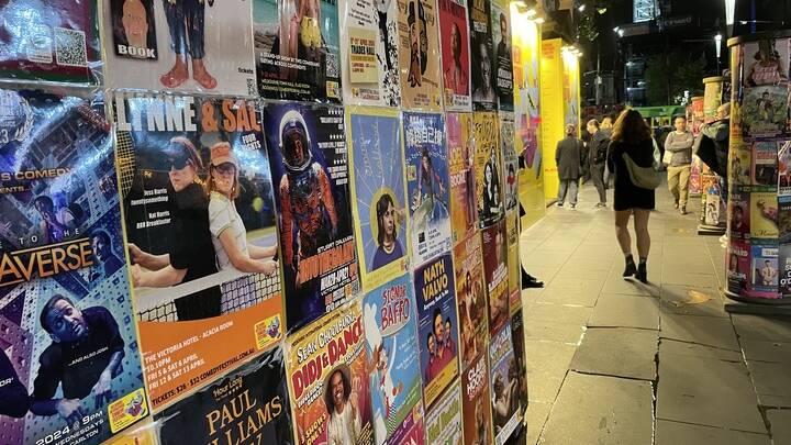 Posters advertising comedy shows cover the city during the annual festival. Picture Anna Houlahan