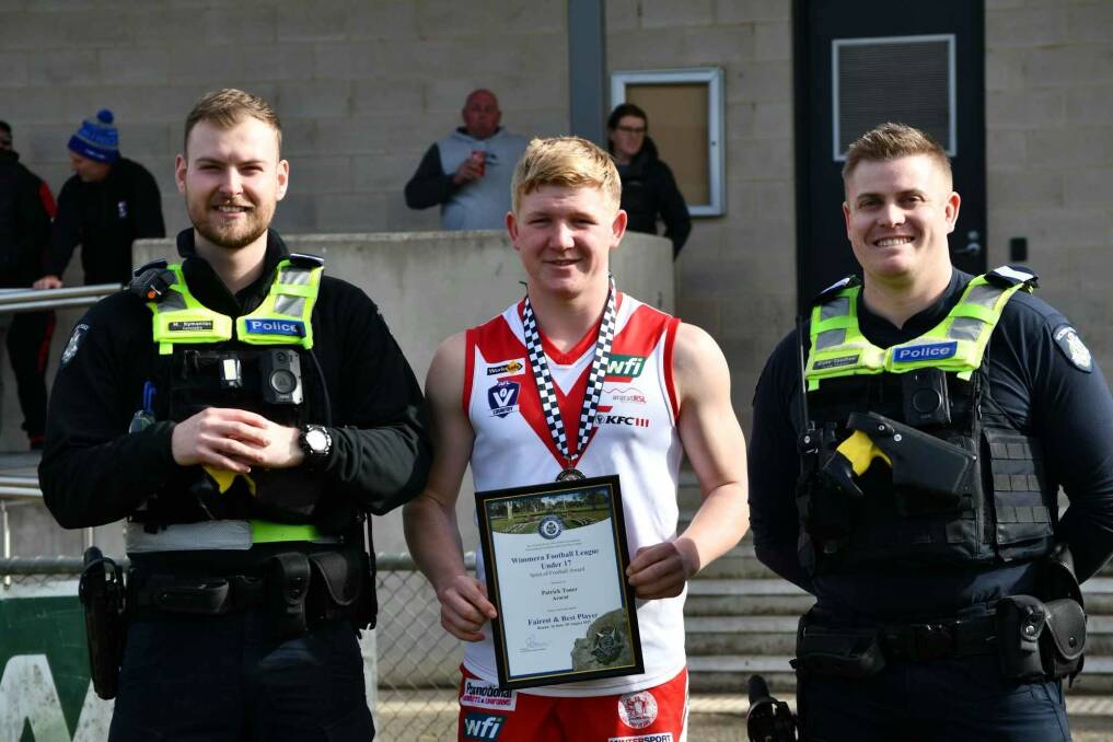 Ararat's Patrick Toner is presented his Blue Ribbon Foundation Spirit of Sport award by Ararat police officers, Acting Sergeant Blake Goodhew and Constable Michael Kymantas. Picture supplied