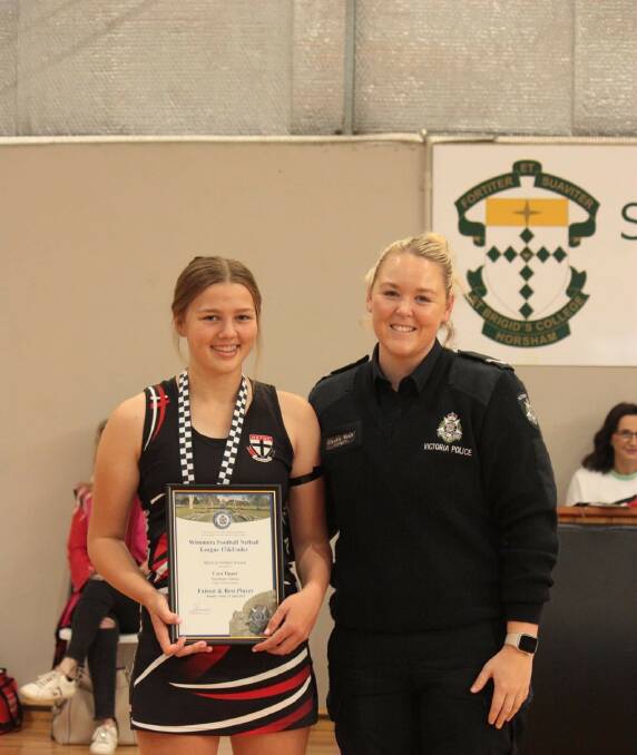 Cara Tippet of the Horsham Saints presented with her round two Spirit of Netball award by Horsham Police First Constable Claudia Wyatt. Picture supplied by M and K Grace Photography. 