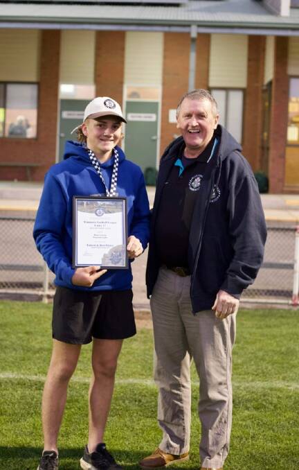 Warrack Eagles' Dane George is presented his Blue Ribbon Foundation Spirit of Football award by foundation member Les Power. Picture supplied
