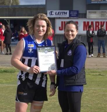 Minyip Murtoa's Will Noble received his Blue Ribbon Foundation Spirit of Football award from Horsham police officer, Senior Constable Angie Clark. Picture supplied