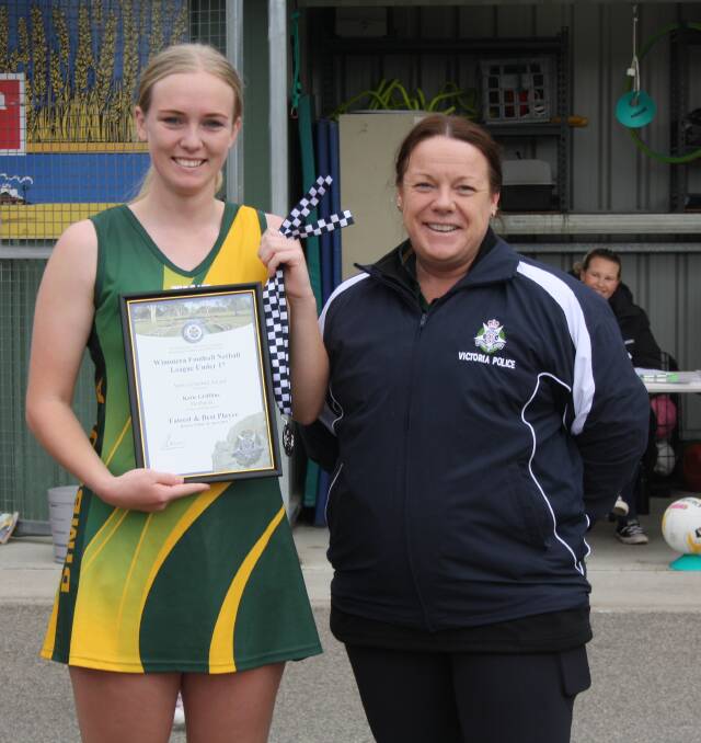 Dimboola 17 and Under netballer Katie Griffiths is presented her Blue Ribbon Foundation Spirit of Netball award by Warracknabeal police officer Anna Lake. Picture supplied. 