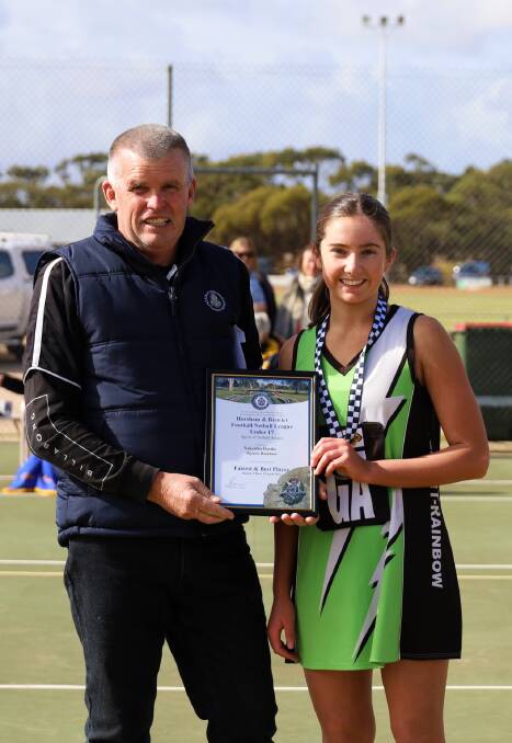The Storms' Nekeisha Bastin is presented her Spirit of Netball award by Rainbow Police Officer, Leading Senior Constable Tony Clark. Picture supplied. 