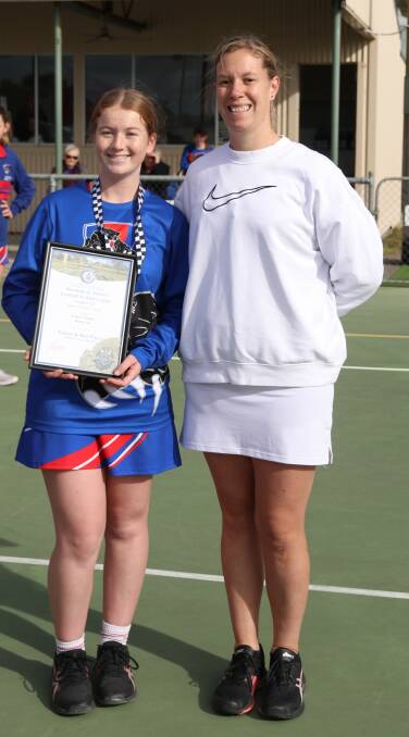Rupanyup's Grace Turner receives her Blue Ribbon Foundation Spirit of Netball award from Horsham police officer, Rebecca Harvey. Picture supplied