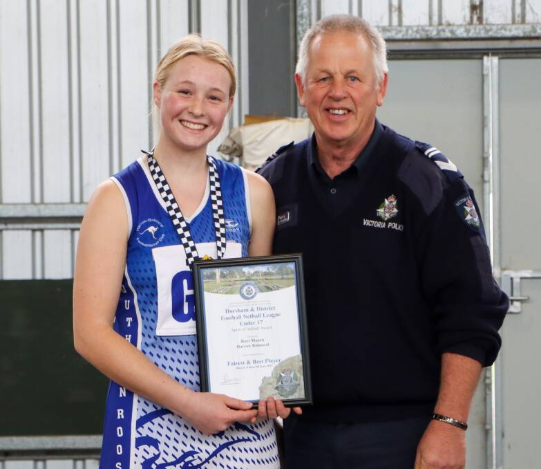 Harrow Balmoral's Rori Mason is presented a Blue Ribbon Foundation Spirit of Netball award by Harrow pollice officer, Leading Senior Constable Alan Perry. Picture supplied 