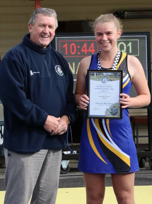 Natimuk United 17 and Under netballer Alexandra Taylor is presented her Blue Ribbon Foundation Spirit of Netball award by Foundation member Les Power. Picture supplied