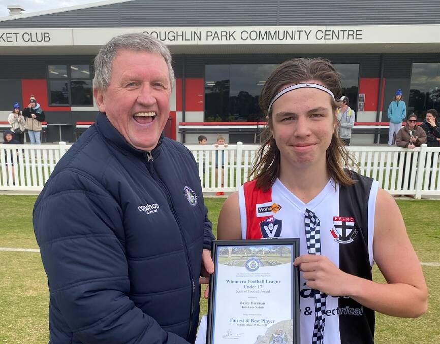 Horsham Saints footballer Bailey Brennan is presented a Blue Ribbon Foundation Spirit of Football award by foundation member Les Power. Picture supplied 