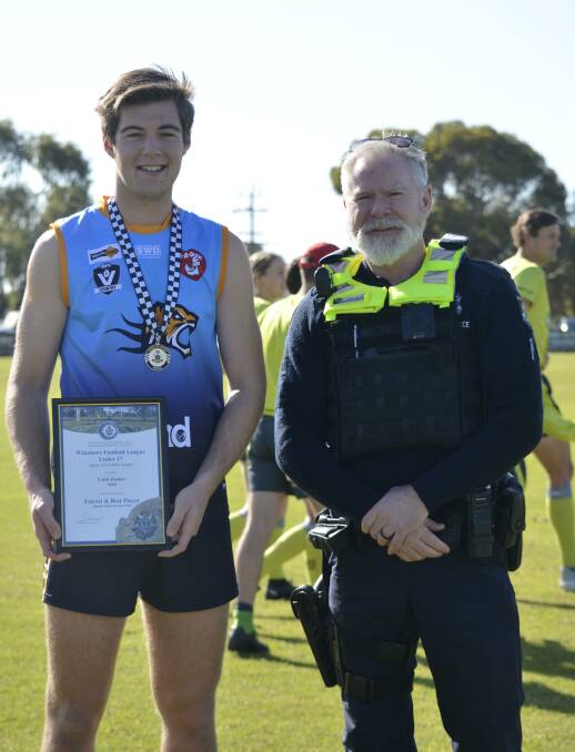 Nhill's Caleb Zanker was presented his Blue Ribbon Foundation Spirit of Football award by Kaniva Police Officer, Sergeant Darren Wright. Picture supplied