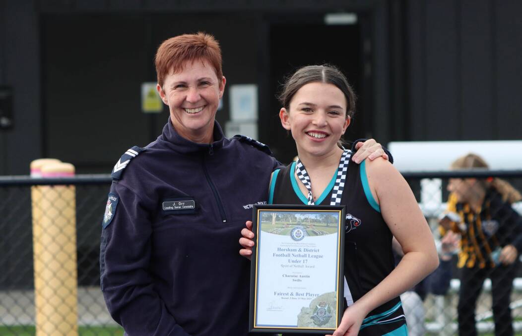 Swifts' netballer Charntae Austin is pictured with Stawell Police Officer Leading Senior
Constable Jo Orr receiving her Spirit of Netball award. Picture by Trish Ralph