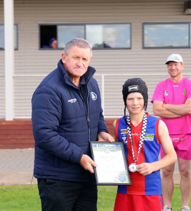 Rupanyup's Hugh Weidemann Is presented his Spirit of Football awrard by Blue Ribbon Foundation member Les Power. Picture supplied. 