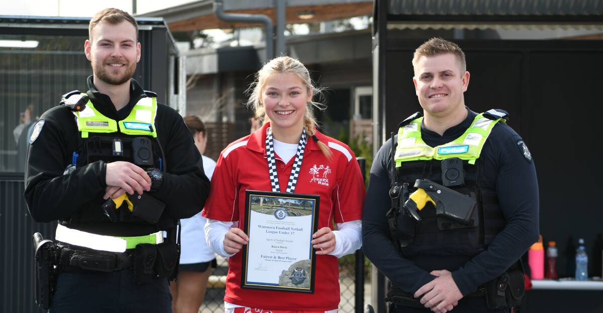 Ararat's Kiara Davis is presented her Blue Ribbon Foundation Spirit of Netball award by Ararat police officers, Acting Sergeant Blake Goodhew and Constable Micheal Kymantas. Picture supplied 