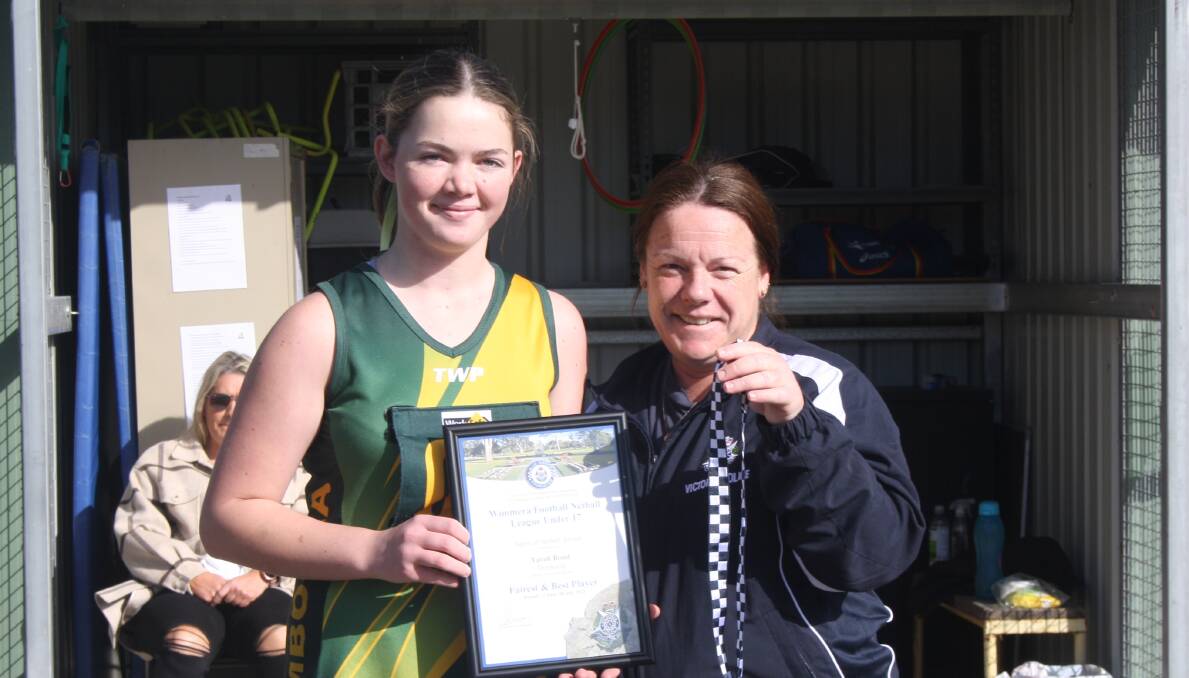 Dimboola's Tarah Bond receives her Blue Ribbon Foundation Spirit of Netball award from Warracknabeal police officer, Acting Sergeant and Dimboola 15 and Under coach Anna Lake. Picture suppled