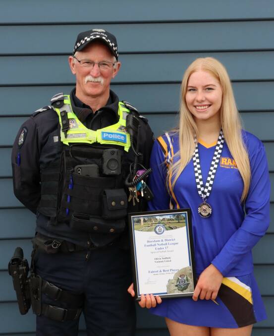 Olivia Sudholz is presented her Blue Ribbon Foundation Spirit of Netball award by Natimuk police officer, Leading Senior Constable Peter Mellington. Picture supplied