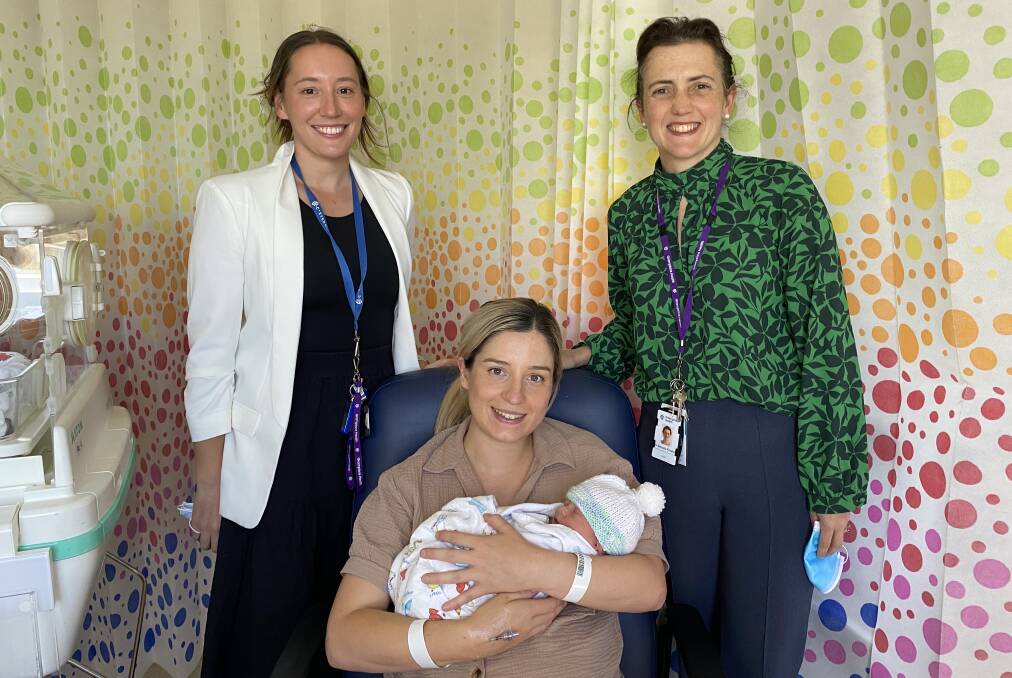 Taegen Burnside, registered midwife and clinical trials coordinator, and Dr Natasha Frawley with Brittany Santilla and her son Max. Picture supplied