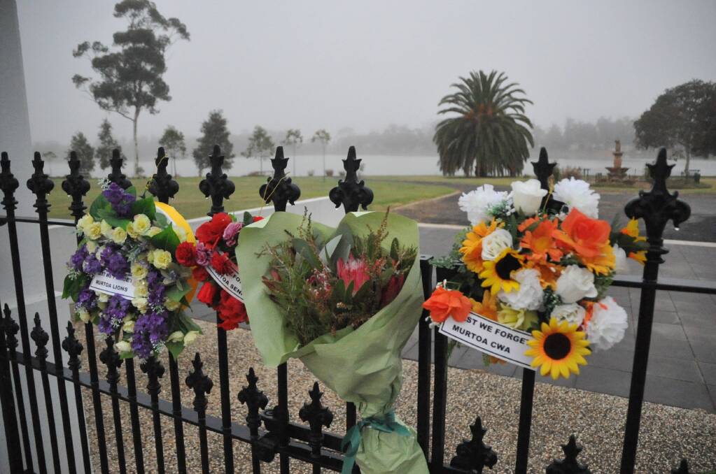 Wreaths and flowers hang from the Murtoa Memorial Gates by the banks of Lake Marma. Picture by John Hall