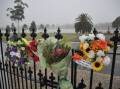 Wreaths and flowers hang from the Murtoa Memorial Gates by the banks of Lake Marma. Picture by John Hall