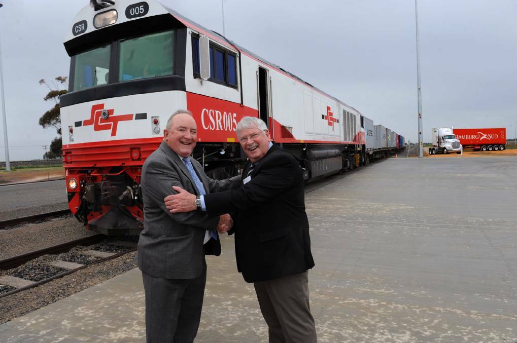 Former Wimmera Intermodal Freight Terminal project manager Kevin McGlinn and former Horsham Rural City Council technical services manager David Eltringham celebrate the opening of the terminal in 2012.