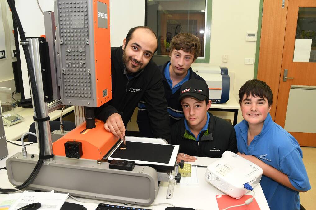 DIGITAL: Research scientist Sahand Assadzadeh with Balmoral Community College students Ewan Weaver, Joel Rees, and Will Lyons at Grains Innovation Park. Picture: SAMANTHA CAMARRI