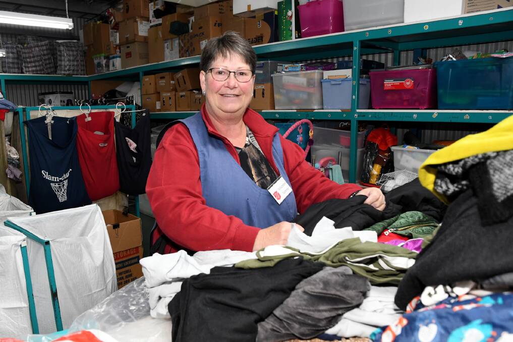 HELPING HAND: Volunteer Tammy Fry sorts clothes at the Salvation Army in Horsham. Picture: SAMANTHA CAMARRI