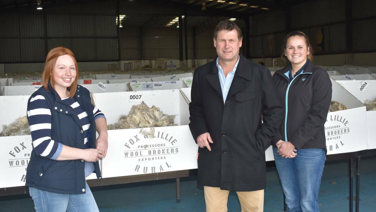 PASSIONATE: Longerenong College students Amy Jackson, of Maroona, and Amy Pilgrim, of Nhill, with Fox and Lillie merino trading manager Peter Maher.