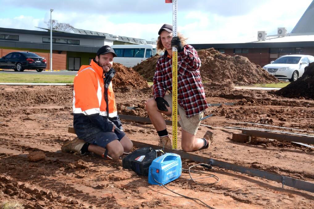 WORKS: Tory Chapple and Connor Gould start work on the therapeutic garden at Warracknabeal. Picture: CONTRIBUTED