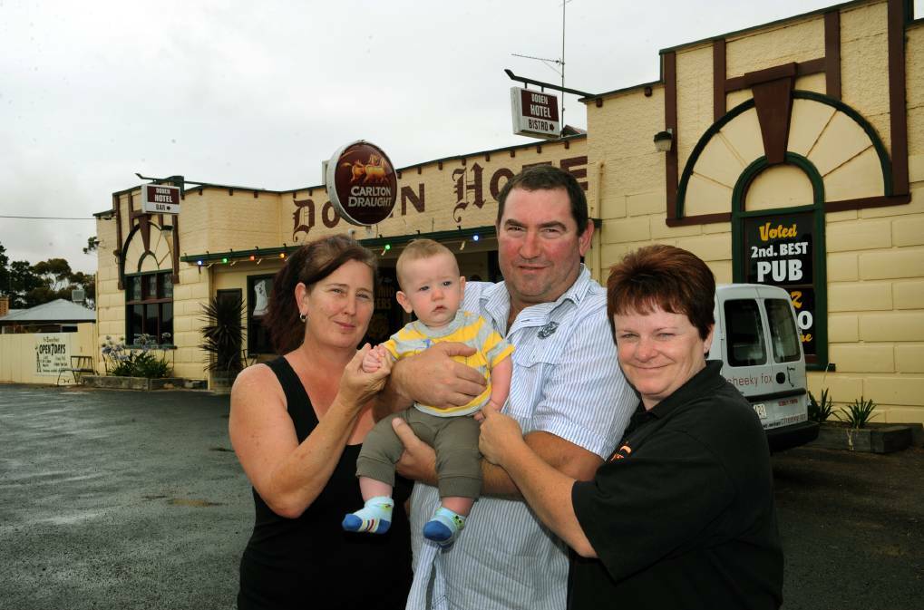 FLASHBACK: Dooen Hotel owners and husband and wife Mick and Helen Harris, right, with Mr Harris's sister Sally Bolwell and her son Harry, four months, outside the business in 2013. The Harrises are returning to the pub.