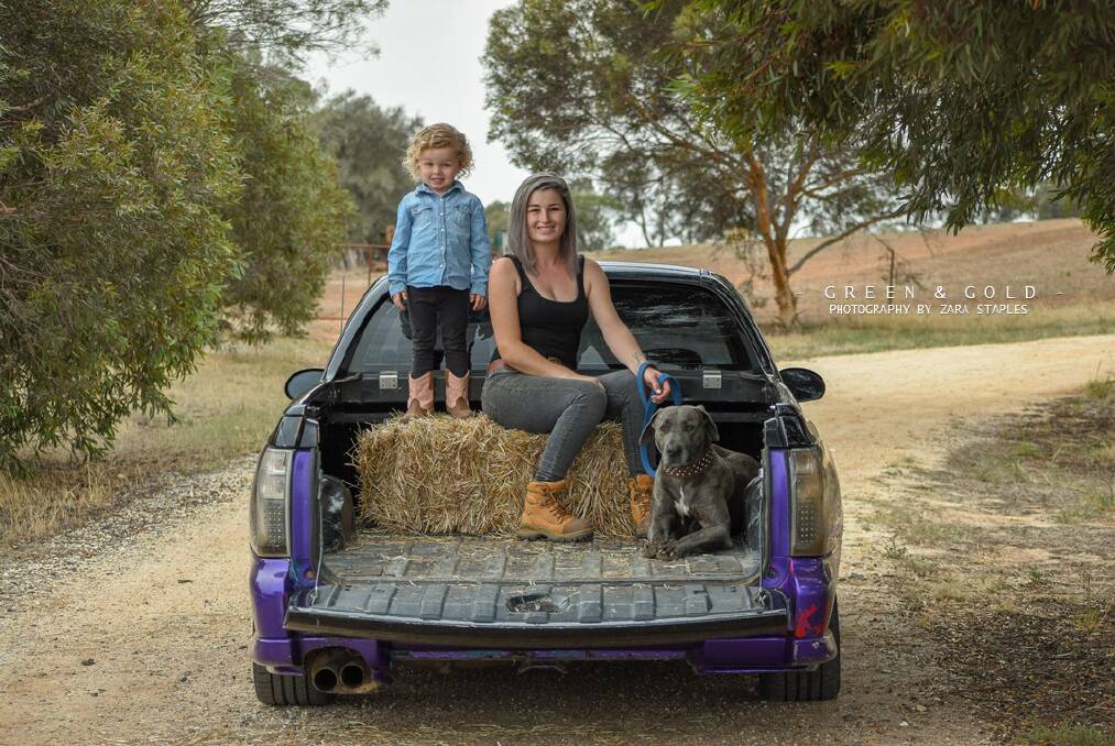 Tayla Wyllie with her daughter Kallani and dog Willow. Picture: ZARA STAPLES