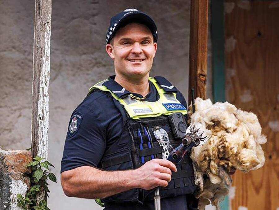 Here hold this, police recruiters convinced First Constable Tom McGrath from Minyip to hold this handpiece and fleece to help lure more recruits to country policing. Pictures: Victoria Police.