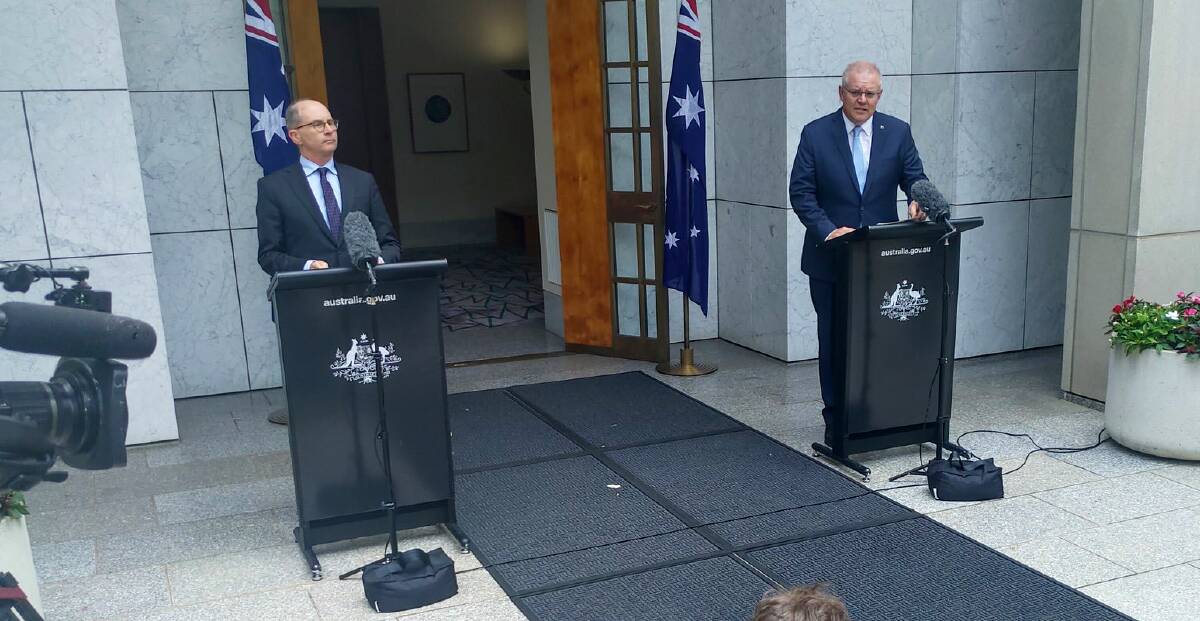 TOUGH DECISIONS: Chief medical officer Paul Kelly, left, and Prime Minister Scott Morrison announce the changes on Friday. Picture: KATIE BURGESS