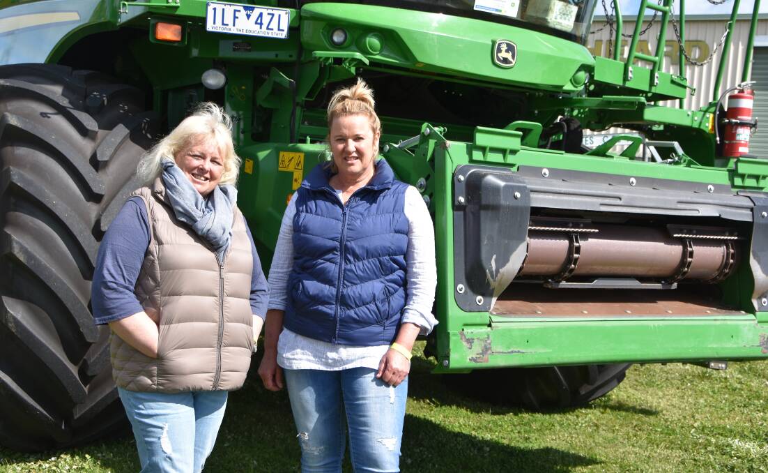Kerry McFarlane and Julie Cummins of Quambatook check out one of the headers on show at the Emmetts Celebrating Women in Agriculture day.