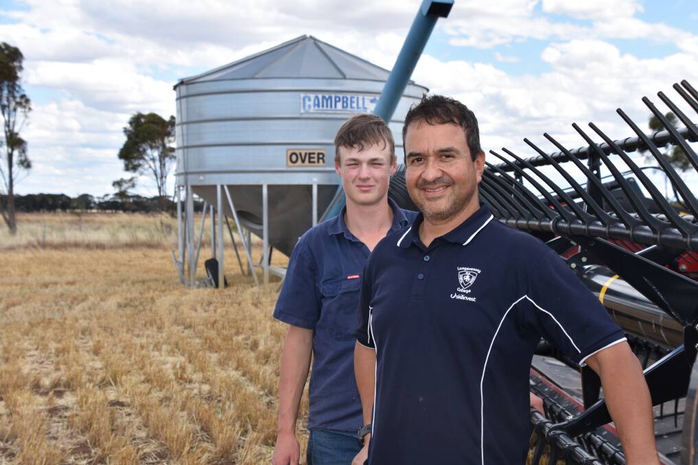 Apprentice Liam Forde, back, together with Longerenong College farm manager Guillermo Sierra at the college farm. Photo by Gregor Heard.