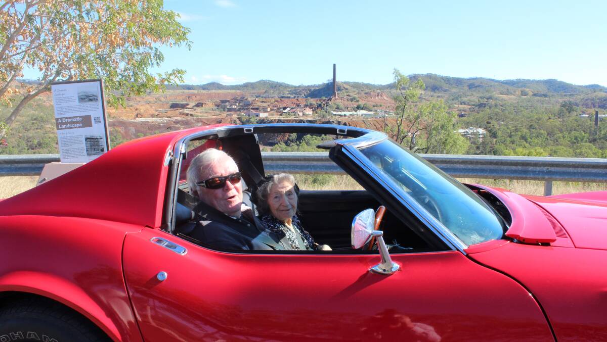 Volunteer John Cole takes 100-year-old Lorna Craney for a spin around Mt Morgan in his 1969 Chevrolet Corvette Stingray.