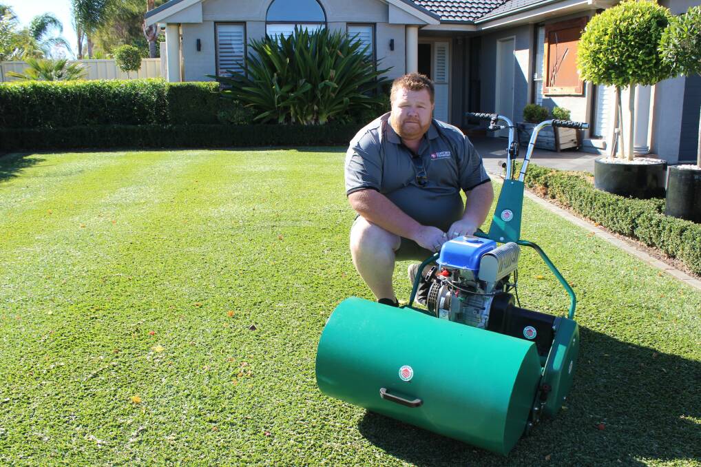 Narellan Vale's Jason Clenton takes great pride in his lawn and maintains it daily. Picture: Ashleigh Tullis