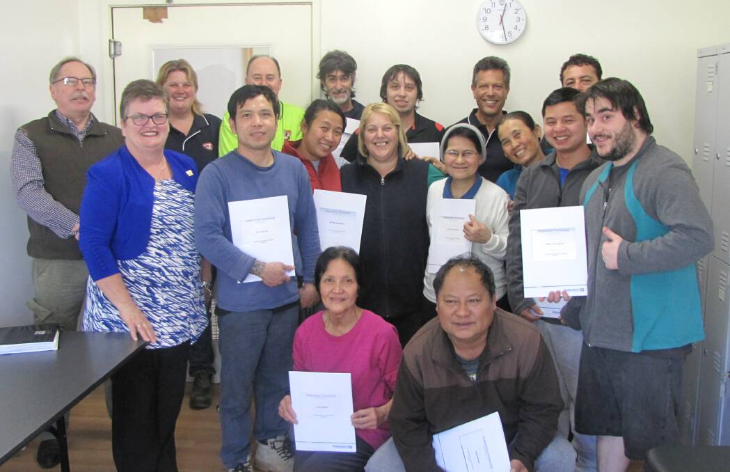 THUMBS UP: Luv A Duck employees received graduation certificates from Luv A Duck's Allan Taylor and Federation University's Geraldine Lewis. Picture: CONTRIBUTED