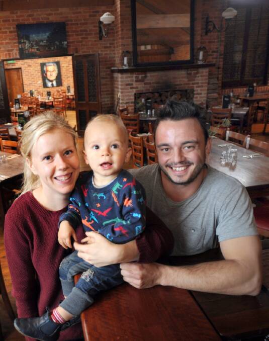 SUCCESS STORY: Bonnie and Clyde’s pizzeria owners Em and Dan Lukazsewski with their 17-month-old son Ambrose. Picture: PAUL CARRACHER