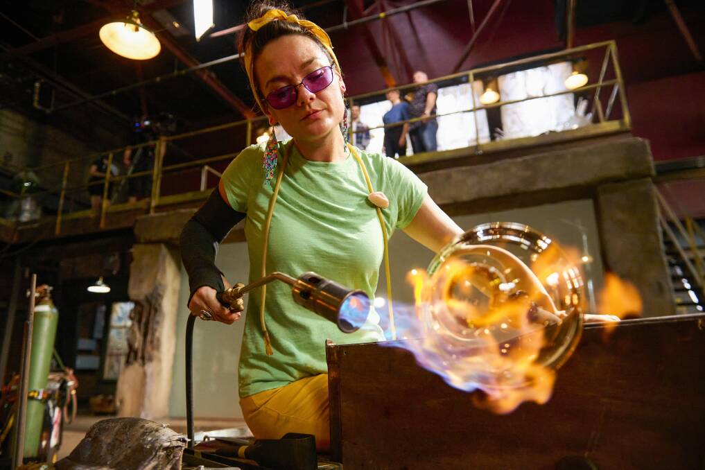 FEELING THE HEAT: Blown Away season three contestant Minhi England applies flame to her glass, while (below) Ryan Gosling stars in The Gray Man. Pictures: Netflix