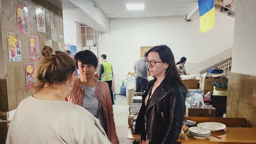 Ms Gray, right, with volunteers at a collective centre. Picture: Supplied