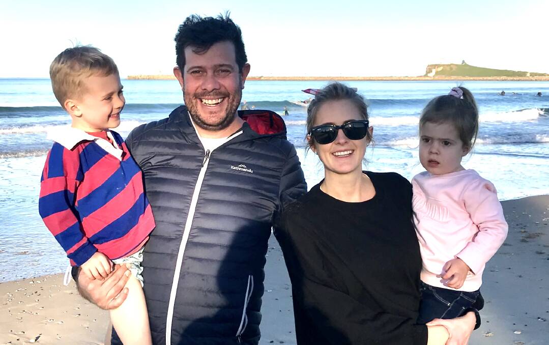 LIFESTYLE CHOICE: Sally Bates on Stockton beach with husband Ben and children Leo, 4, and Milly, 2.