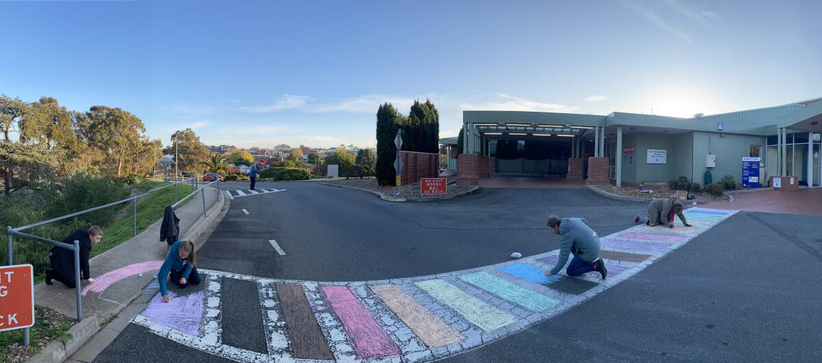 COLOUR MY WORLD: Rhys Duncan, Director of Primary and Community Care, Beth Eldridge, SRH Speech Pathologist and project coordinator, Jackie Lazones , staff member and Sarah Albourough, LGBTI community representative started early with their chalk. Picture: SUPPLIED